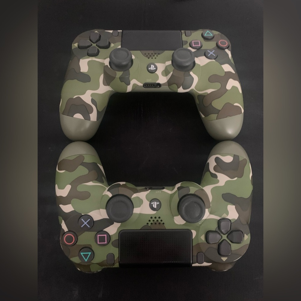 Two DualShock Green Camouflage PlayStation4 controllers